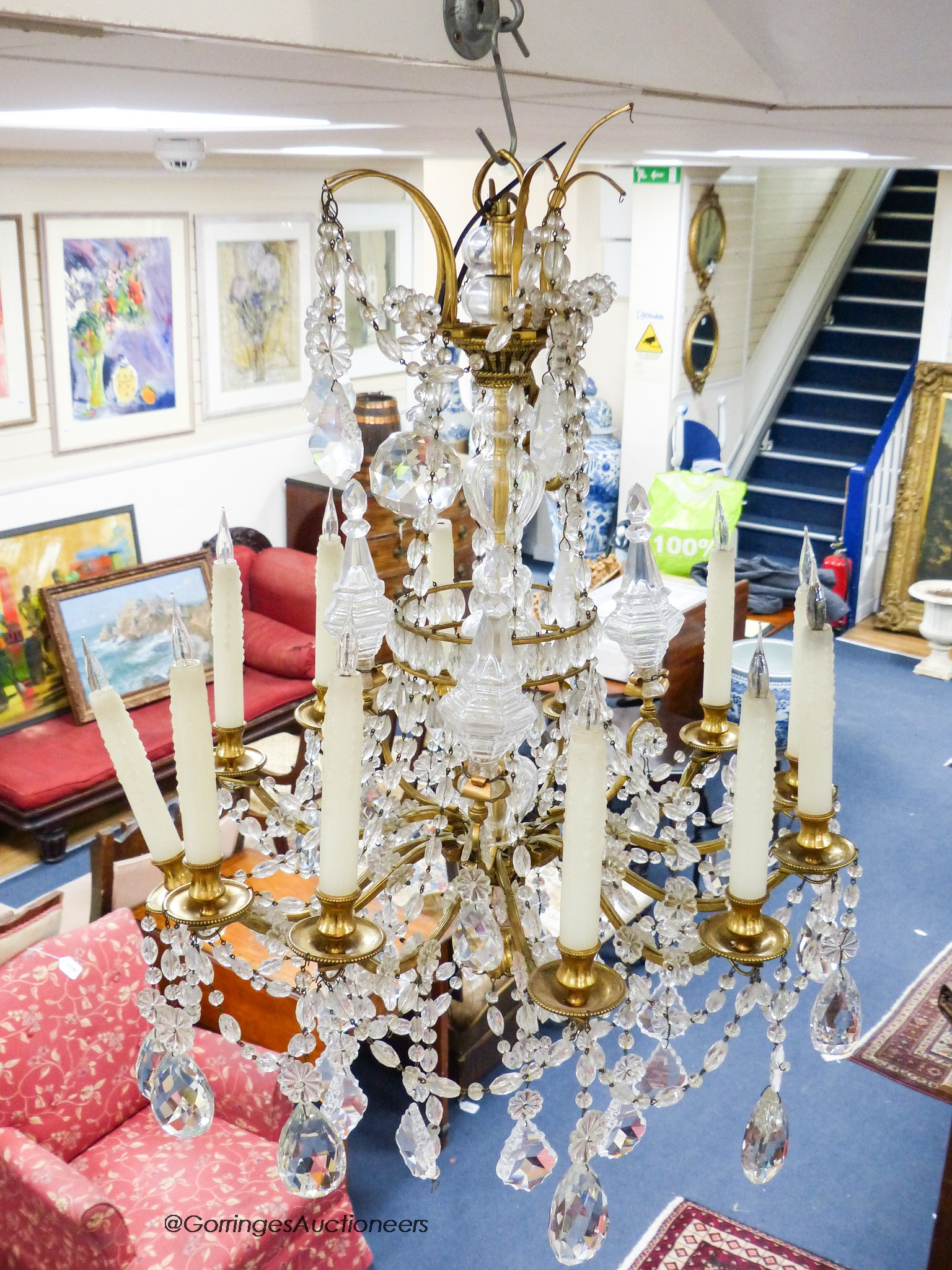 A gilt metal mounted and crystal twelve branch chandelier